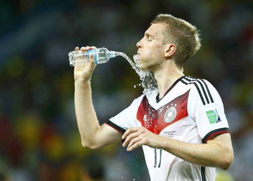 Germany's Per Mertesacker refreshes himself after the 2014 World Cup Group G soccer match between Germany and Ghana at the Castelao arena. u00e2u20acu201d Reuters pic