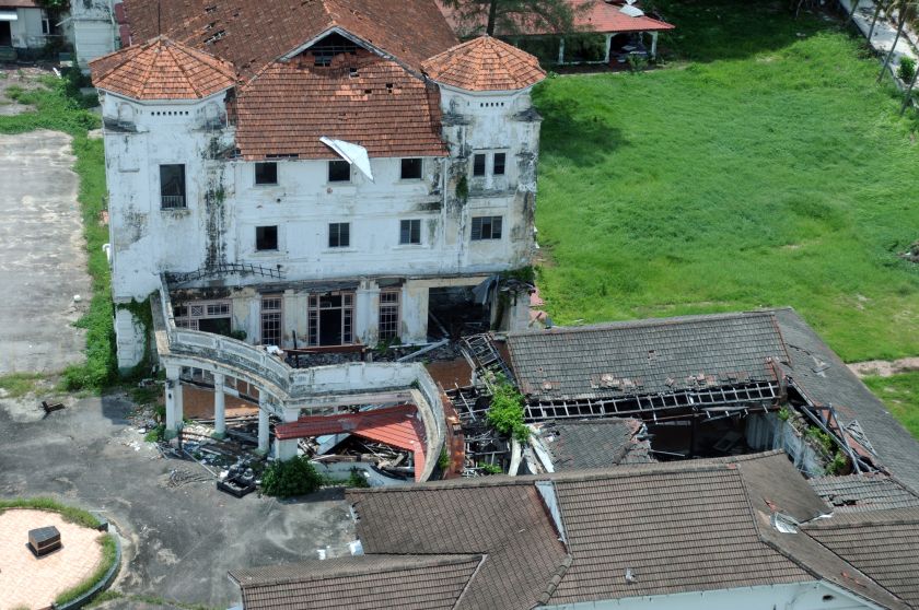 Parts of the roof of the Runnymede Hotel buildings have caved in while sections of its walls are in ruins. ― Picture by K.E.Ooi