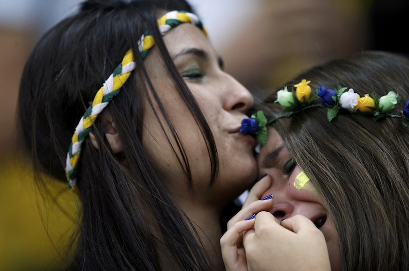 A fan of Brazil is consoled after they lost their 2014 World Cup third-place playoff against the Netherlands at the Brasilia national stadium in Brasilia July 13, 2014.u00c2u00a0u00e2u20acu201d Reuters pic