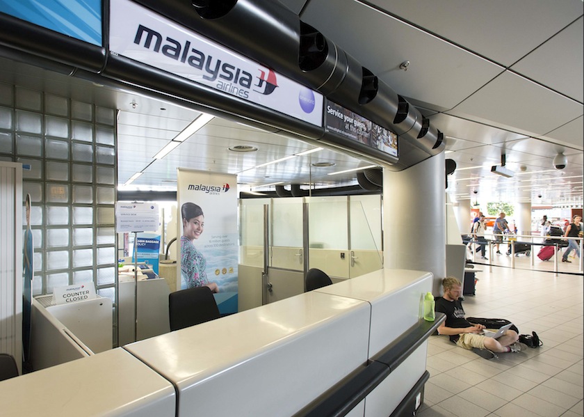 The desk of Malaysia Airways is seen at Schiphol Airport July 18, 2014.  u00e2u20acu201d Reuters pic