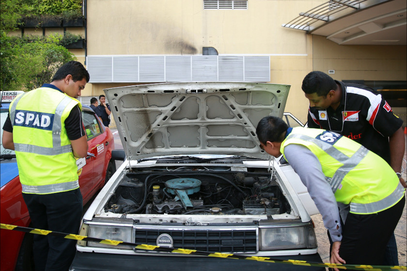 Land Public Transport Commission (SPAD) officials conduct a check on taxi drivers in Kuala Lumpur, on July 14, 2014. u00e2u20acu201d Picture by Saw Siow Feng