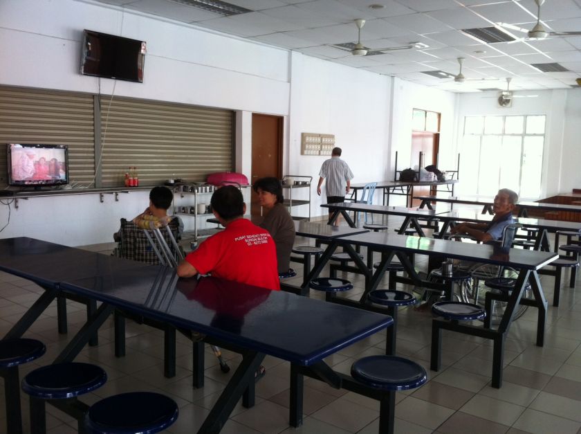 Residents at the Sungai Buloh centre for the beggars and homeless watch TV. u00e2u20acu2022 Picture by Boo Su-Lyn