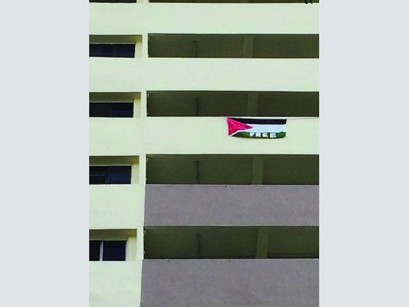 A Palestinian flag was seen hanging on the 11th floor of Block 54 Sims Drive yesterday. u00e2u20acu201d Today pic
