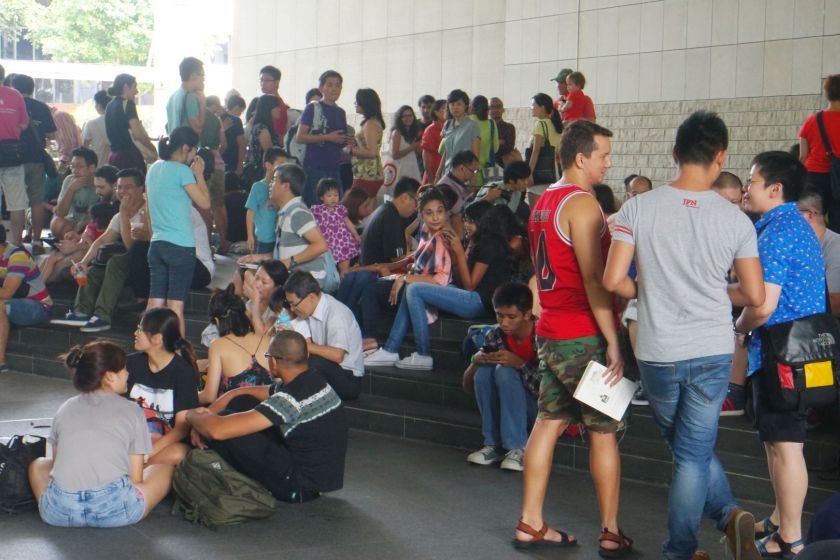 Several hundred people turn up for a reading event held at the Singapore National Library atrium on July 13. u00e2u20acu201du00e2u20acu201d TODAY pic