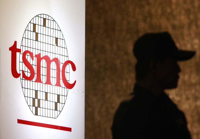 A security personnel stands near the logo of Taiwan Semiconductor Manufacturing Co. Ltd (TSMC) during an investor conference in Taipei, July 16, 2014.  u00e2u20acu201d Reuters pic