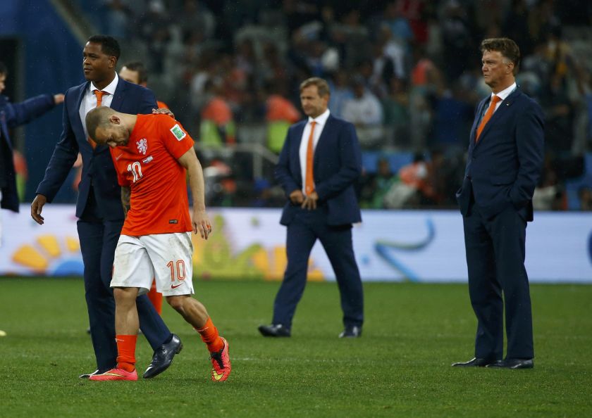 Wesley Sneijder of the Netherlands is comforted by assistant coach Patrick Kluivert at the end of their 2014 World Cup semi-finals against Argentina at the Corinthians arena in Sao Paulo July 10, 2014. u00e2u20acu201d Reuters pic