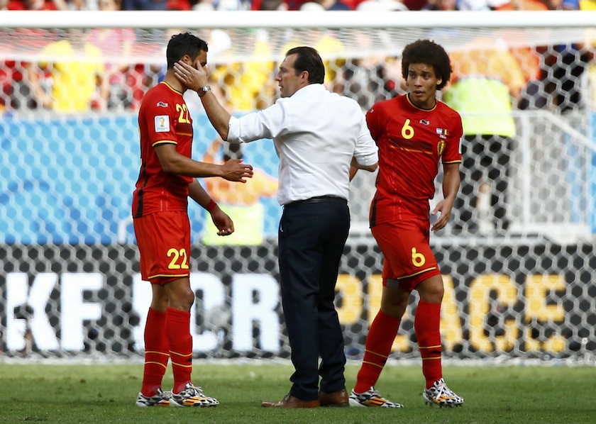 Belgium's coach Marc Wilmots consoles Nacer Chadli, as Axel Witsel watches, after the 2014 World Cup quarter-finals between Argentina and Belgium at the Brasilia national stadium in Brasilia July 6, 2014.u00c2u00a0u00e2u20acu201d Reuters pic