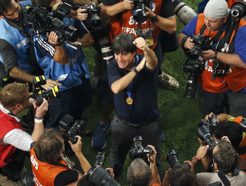 Photographers take pictures of Germany's coach Joachim Loew as he celebrates winning the 2014 World Cup final against Argentina at the Maracana stadium in Rio de Janeiro July 14, 2014.u00c2u00a0u00e2u20acu201d Reuters pic