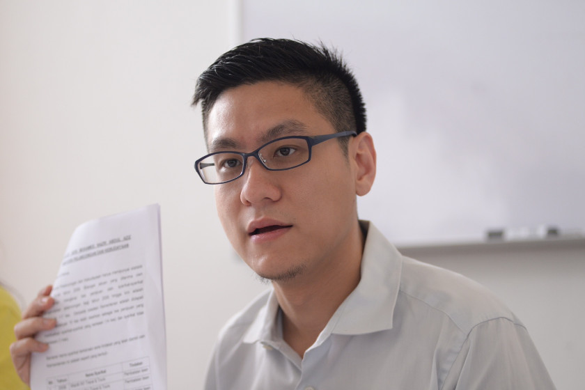 DAP MP Zairil Khir Johari shows a document showing the blacklisted tourism company. u00e2u20acu201dPicture by K.E. Ooi