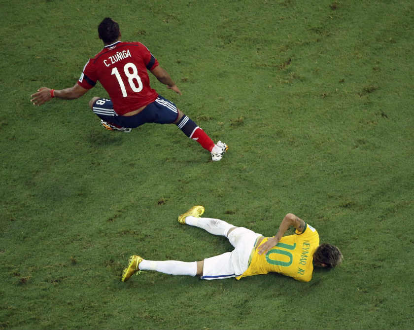 Brazil's Neymar holds his back after being challenged by Colombia's Camilo Zuniga during their 2014 World Cup quarter-final match at the Castelao arena in Fortaleza July 4, 2014. u00e2u20acu201d Reuters pic