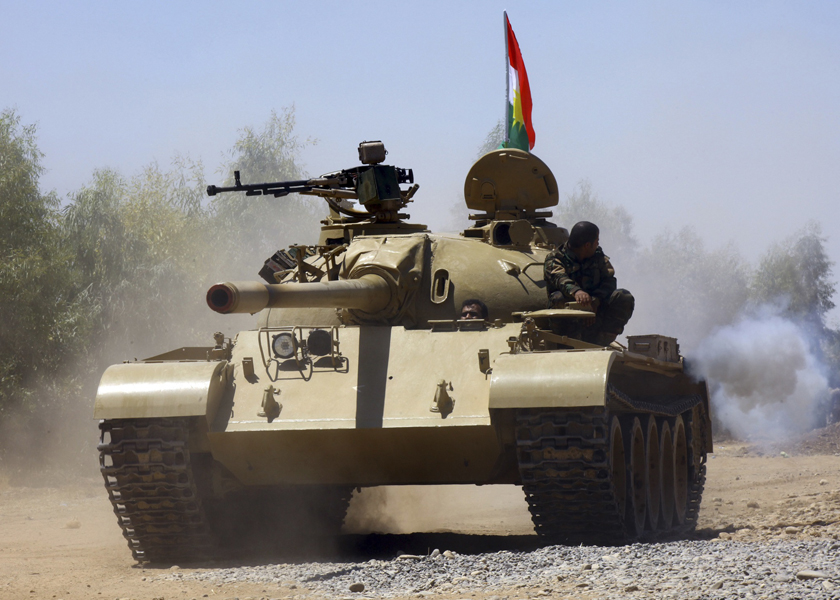Kurdish peshmerga troops patrol in a tank during an operation against Islamic State militants in Makhmur, on the outskirts of the province of Nineveh, August 8, 2014. u00e2u20acu201d Reuters pic