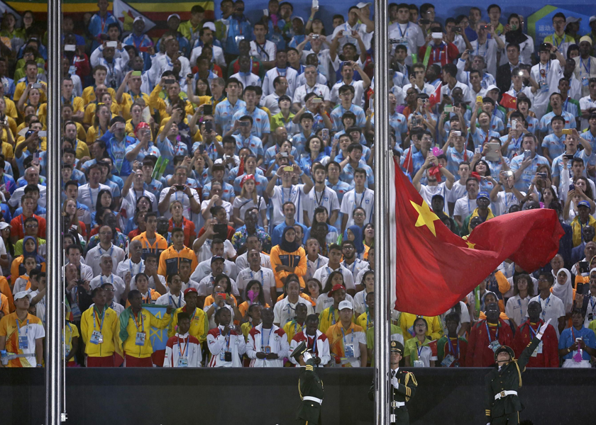 A paramilitary police officer raises the Chinese national flag out in a flag-raising ceremony during the 2014 Nanjing Youth Olympic Games, August 18, 2014. u00e2u20acu201d Reuters pic