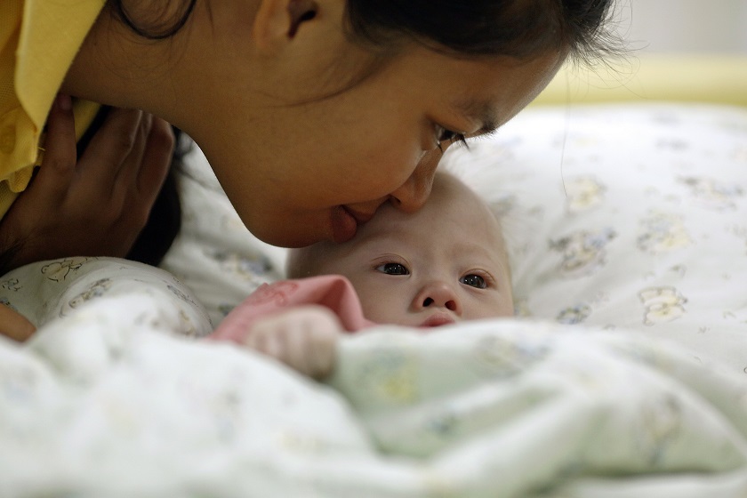 Gammy, a baby born with Downu00e2u20acu2122s Syndrome, is kissed by his surrogate mother Pattaramon Janbua at a hospital in Chonburi province August 3, 2014. u00e2u20acu201d Reuters pic