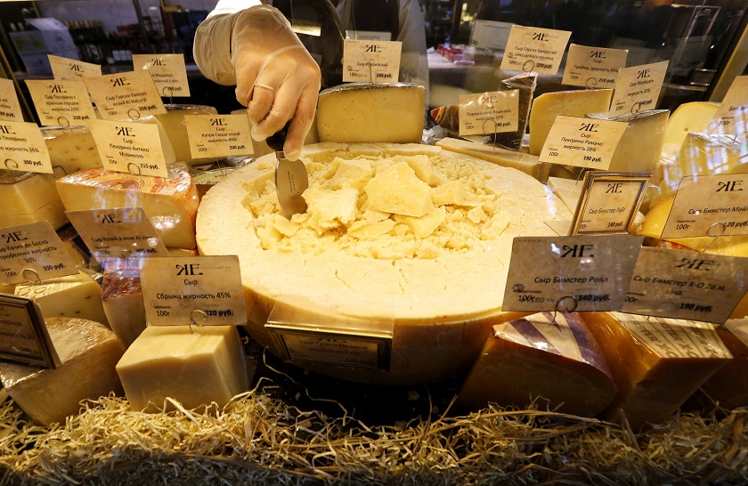 A worker arranges cheese for sale at a grocery store in St Petersburg August 12, 2014. u00e2u20acu201d Reuters pic