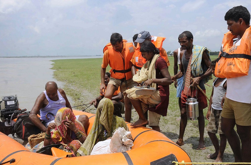 National Disaster Response Force (NDRF) personnel evacuate villagers at Supaul district in the eastern Indian state of Bihar August 3, 2014. u00e2u20acu201d Reuters pic