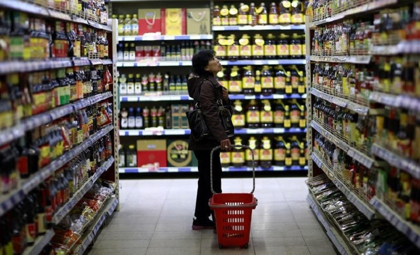 A customer looks at items displayed on shelves at a supermarket in Shenyang, Liaoning province. Official data indicate Chinau00e2u20acu2122s annual inflation rose 2.3 per cent in July. u00e2u20acu201d Reuters pic