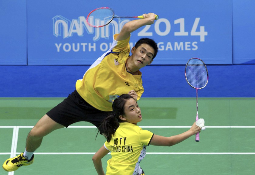 File picture shows national badminton player, Cheam June Wei (rear) paired with Hong Kongu00e2u20acu2122s Ng Tsz Ya in action against their opponents at the Youth Olympic Games in Nanjing, August 22, 2014. u00e2u20acu201d Bernama pic
