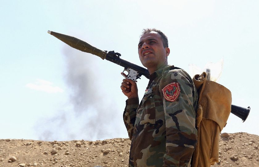 A member of the Kurdish peshmerga takes his position holding a rocket-propelled grenade (RPG) launcher during an intensive security deployment against Islamic State militants, on the outskirts of the province of Nineveh, August 6, 2014 Reuters