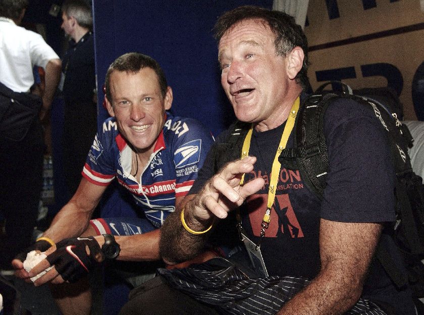 Robin Williams jokes with Lance Armstrong the Tour de France July 20, 2004 Reuters