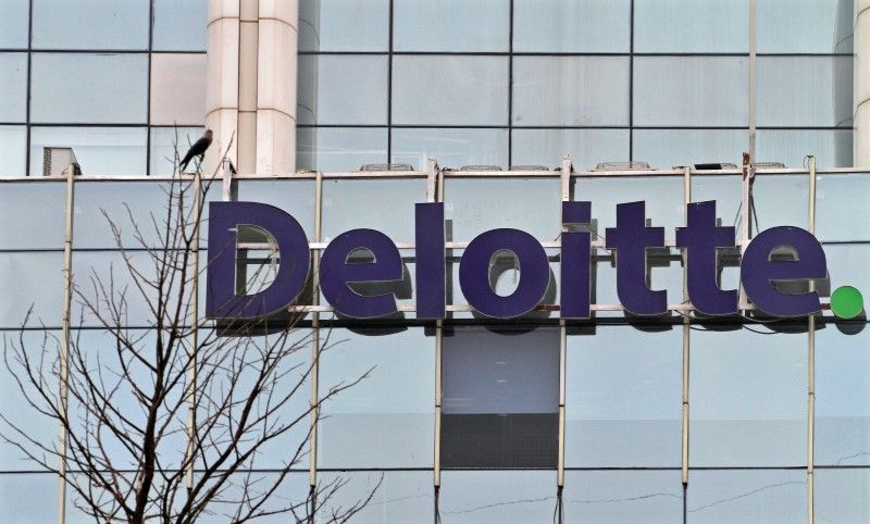 The Deloitte Company logo is seen on a commercial tower at Gurgaon, on the outskirts of New Delhi August 9, 2012 Reuters