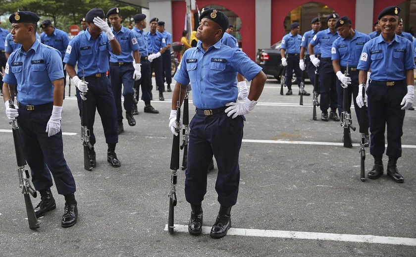 Malaysian policemen participate in a dress rehearsal for the upcoming Merdeka Day celebrations at Dataran Merdeka in Kuala Lumpur August 28, 2014. u00e2u20acu201d Reuters pic
