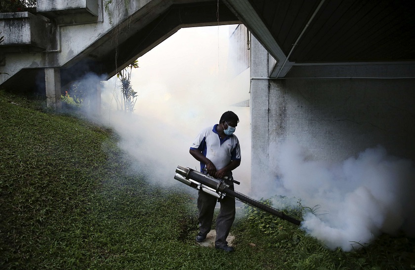A pest control worker sprays insecticide to help control the spread of dengue fever carried by mosquitoes in Kuala Lumpur August 27, 2014. u00e2u20acu201d Reuters pic 