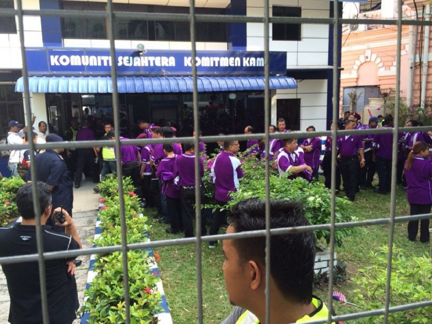 PPS members, clad in their purple T-shirts, were taken to the Beach Street police station after they finished the march past in the Merdeka parade, on August 31, 2014. u00e2u20acu201d Picture courtesy of Sim Tze Tzin