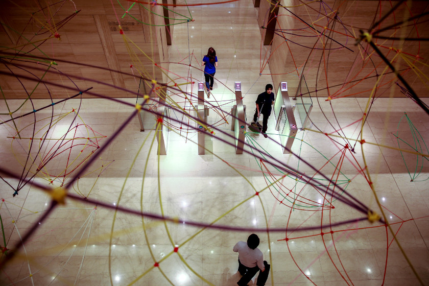 The crowd walking under an art installation at The Intermark, on August 1, 2014. u00e2u20acu201d Picture by Saw Siow Feng