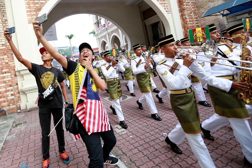 nPeople pose for selfies at the parade and procession in conjunction with the Merdeka Day celebrations at Dataran Merdeka, Kuala Lumpur August 31, 2014. u00e2u20acu201d Picture by Saw Siow Feng n