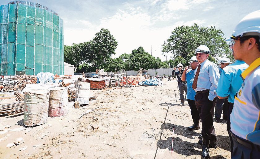 Works Minister Datuk Fadillah Yusof inspects a construction site for potential breeding grounds of the Aedes mosquitoes. u00e2u20acu201d Bernama pic
