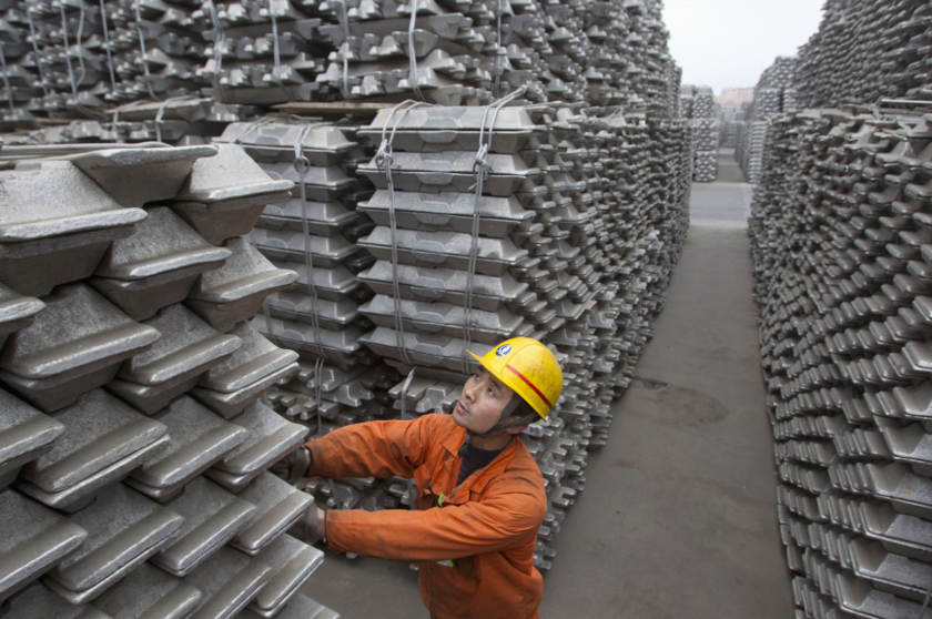 An employee checks aluminium ingots for export at Qingdao Port, Shandong province, in this March 14, 2010 file photo. u00e2u20acu201d Reuters pic