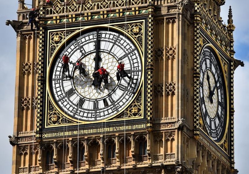 Technicians carry out cleaning and maintenance work on one of the faces of the Great Clock atop the landmark Elizabeth Tower that houses Big Ben, attached to the Houses of Parliament, in London, on August 19, 2014. u00e2u20acu2022 AFP pic