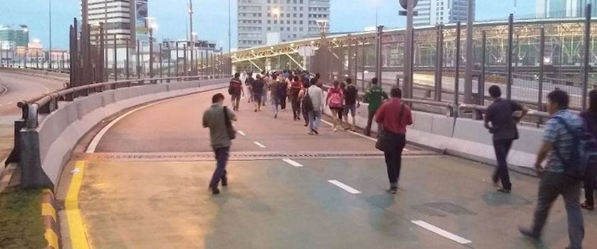Bus commuters resorting to walking into Singapore on August 1, 2014 because of a reported strike by Malaysian bus drivers at the Johor Checkpoint. u00e2u20acu201d Today pic