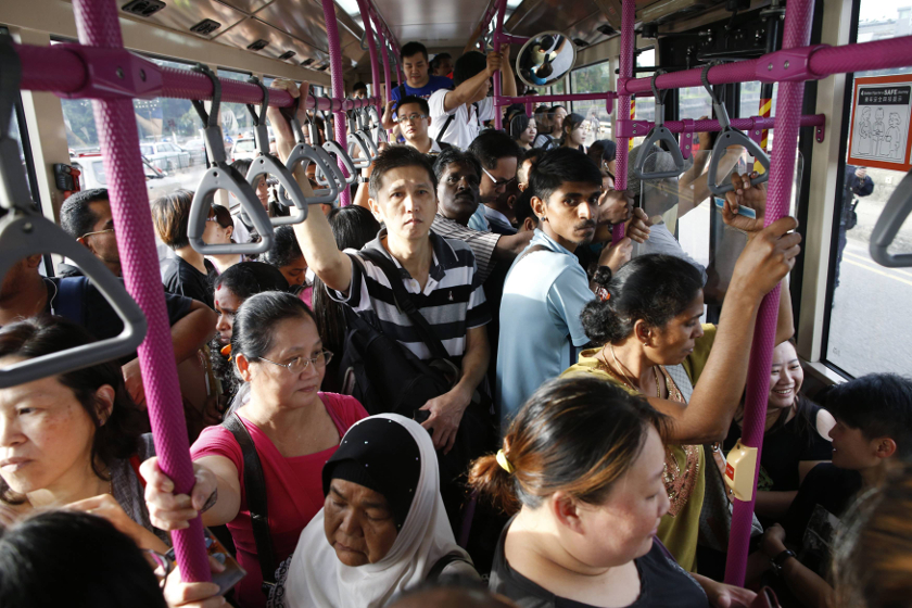Commuters, among those who were affected by delays in bus services coming from Johor Baru, travel on a bus to Malaysia from Singapore's Woodlands Checkpoint August 1, 2014. u00e2u20acu201d Reuters pic
