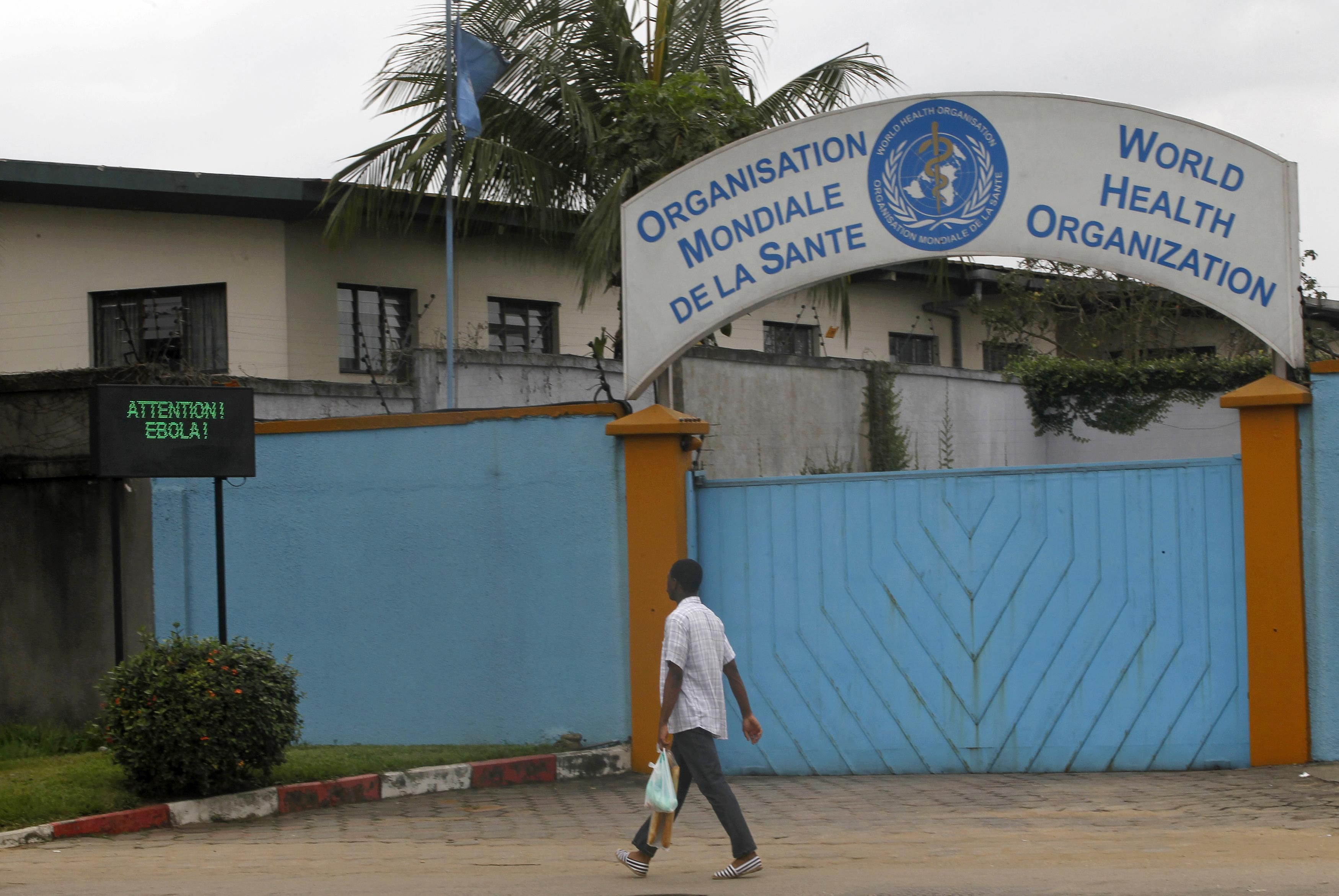 A man walks near a screen displaying a message on Ebola outside the local headquarters of the World Health Organisation (WHO) in Abidjan August 15, 2014. u00e2u20acu201d Reuters pic