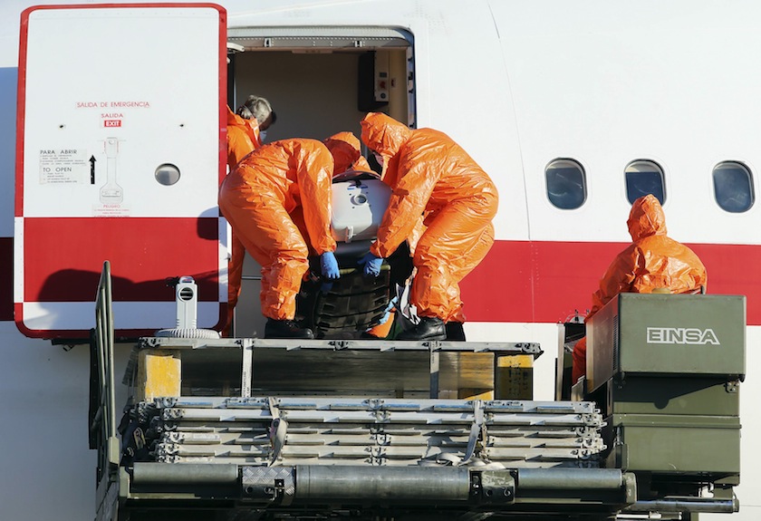 Air force personnel unload Ebola patient, Spanish priest Miguel Pajares, from an airplane at Torrejon airbase in Madrid, after he was repatriated from Liberia for treatment in Spain, August 7, 2014. u00e2u20acu201d Reuters pic