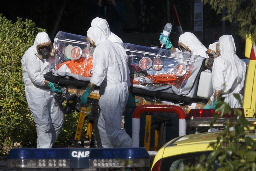 Health workers in protective gear wheel a stretcher into a hospital with one of two Spaniards who were repatriated from Liberia, shortly after their arrival in Madrid, August 7, 2014. u00e2u20acu201du00c2u00a0Reuters pic