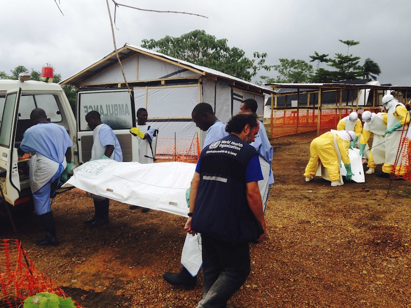 Volunteers carry bodies in a centre run by Medecins Sans Frontieres for Ebola patients in Kailahun August 2, 2014. u00e2u20acu201du00c2u00a0Reuters pic