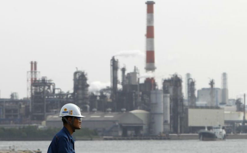 A worker is seen near a factory in Keihin industrial zone in Kawasaki, south of Tokyo May 31, 2011. u00e2u20acu201d Reuters pic
