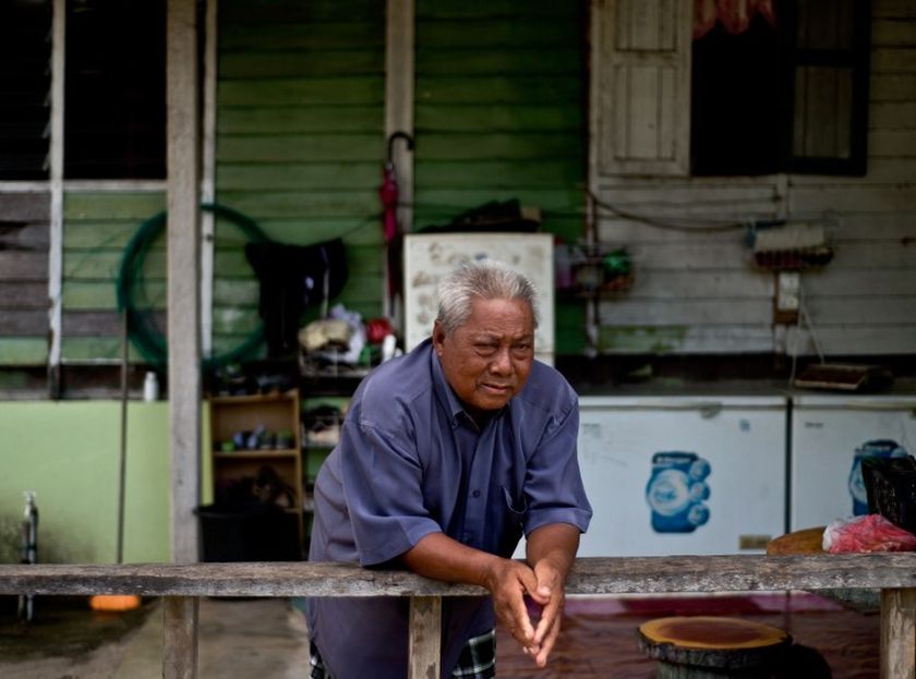 In this picture taken on June 8, 2014, a 68 year-old fish listener Harun Muhammad poses at his home after returning from fishing in Setiu lagoons. u00e2u20acu2022 AFP pic