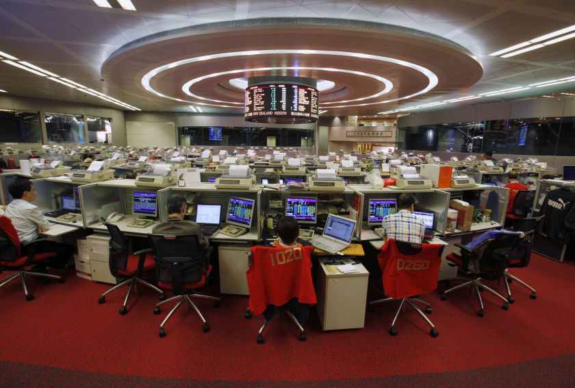 Floor traders work during afternoon trading at the Hong Kong Stock Exchange in a picture released August 5, 2014. Hong Kong is rushing to launch an initiative to allow global investors trade Chinese stocks from the city for the first time. u00e2u20acu201d Reuters pic