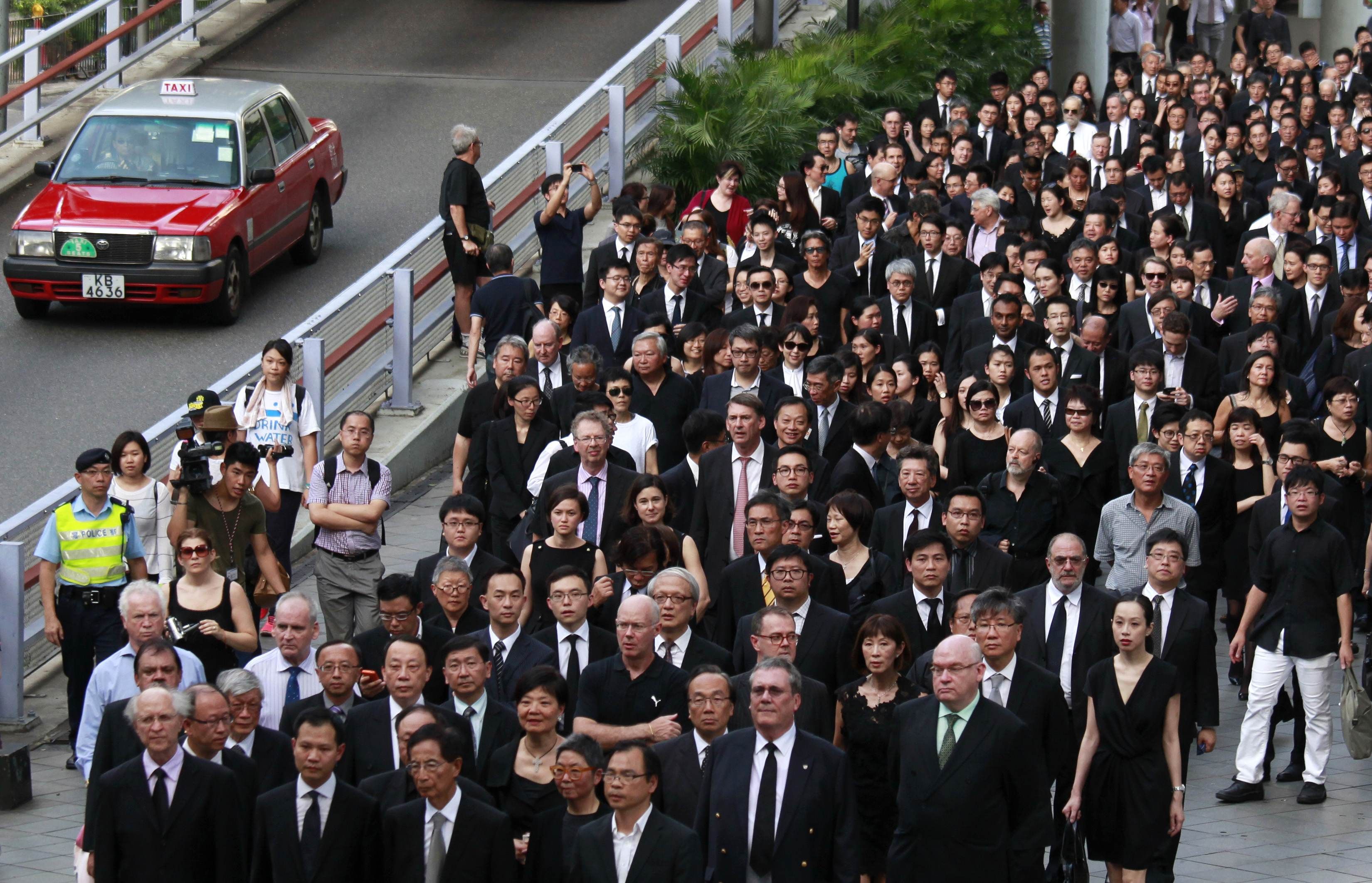 Barristers, solicitors and other members from the legal profession, wearing black, take part in a march of silence in Hong Kong in this June 27, 2014 file photo. u00e2u20acu201d Reuters pic