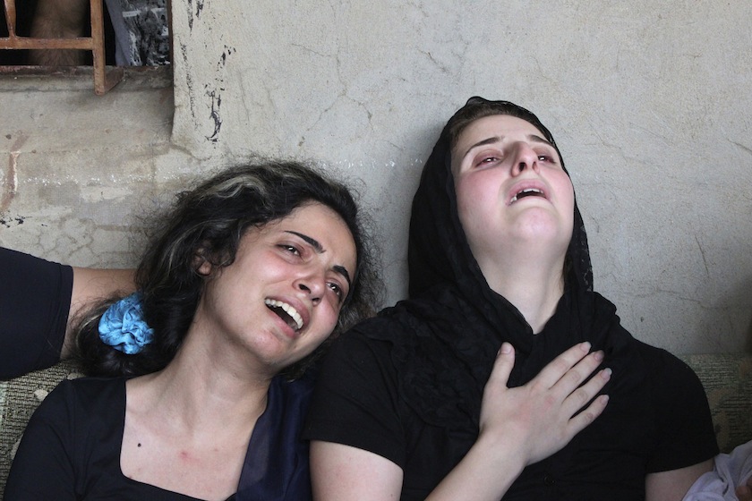 Relatives of Alawite soldier Ali Khaddaaro, who was killed during clashes between Lebanese Army soldiers and Islamist militants in Arsal, mourn during his funeral in Talhmera village, Akkar  August 5, 2014. u00e2u20acu201d Reuters pic