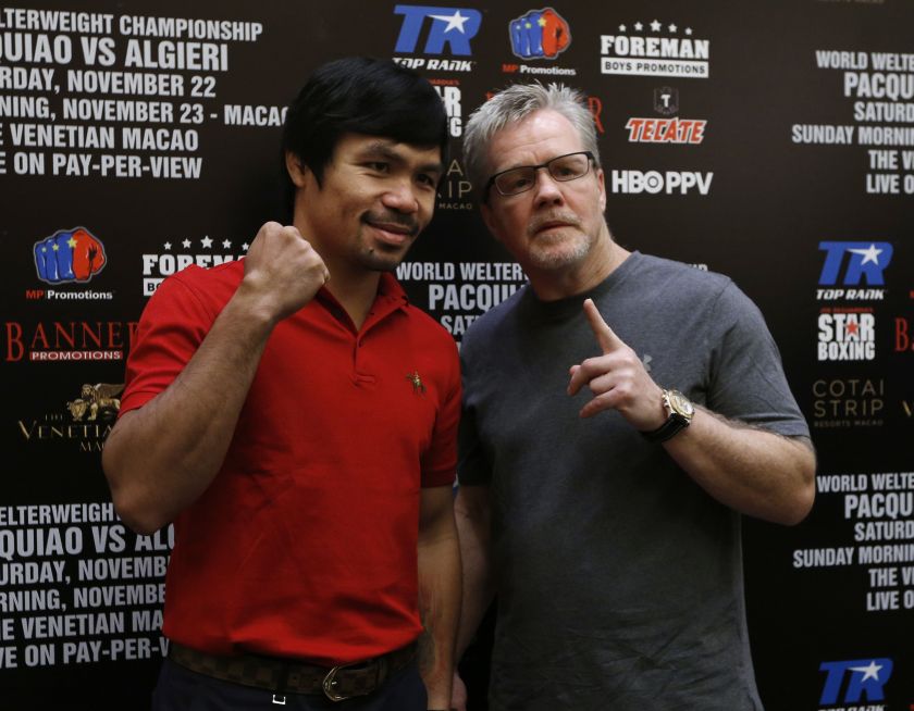 Pacquiao (left) and his trainer Freddie Roach pose during an interview at Venetian Macao in Macau August 25, 2014. u00e2u20acu201d Reuters pic