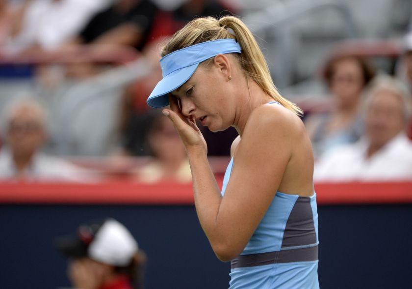Maria Sharapova reacts during her macth against Carla Suarez Navarro on day four of the Rogers Cup tennis tournament at Uniprix Stadium, Aug 7, 2014. u00e2u20acu201d Picture by Eric Bolte-USA TODAY Sports