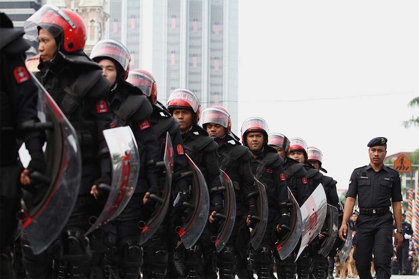 Police officers in riot gear march during Merdeka Day celebrations in Kuala Lumpur August 31, 2014.  u00e2u20acu201d Picture by Yusof Mat Isa