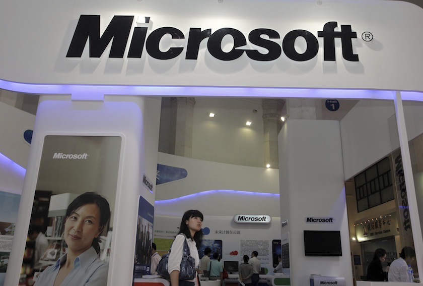 A visitor walks past a Microsoft booth at a computer software expo in Beijing, June 2, 2010.u00c2u00a0u00e2u20acu201d Reuters pic