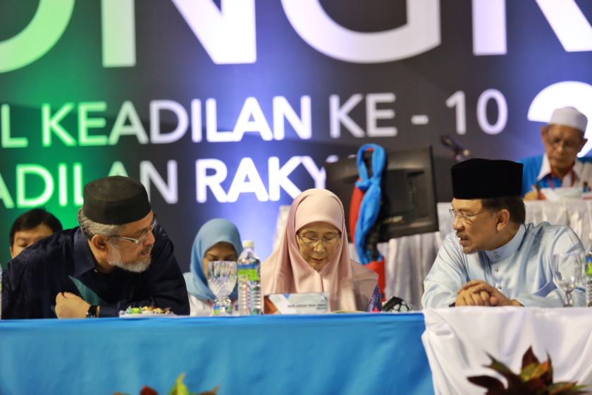 (From left) PAS MP Khalid Samad, PKRu00e2u20acu2122s Datuk Seri Dr Wan Azizah, and Datuk Seri Anwar Ibrahim are seen at the 2014 PKR Congress in Shah Alam, August 23, 2014. u00e2u20acu2022 Picture by Saw Siow Feng