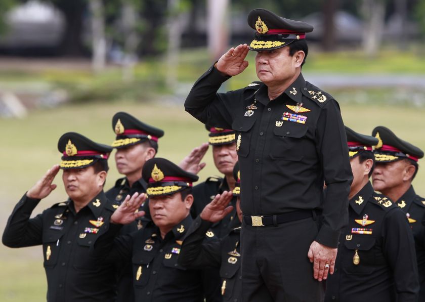 Thailandu00e2u20acu2122s newly-appointed Prime Minister Prayuth Chan-ocha (front) reviews honour guards of the 21st Infantry Regiment, Queenu00e2u20acu2122s Guard in Chonburi province, outside Bangkok August 21, 2014. u00e2u20acu201d Reuters pic