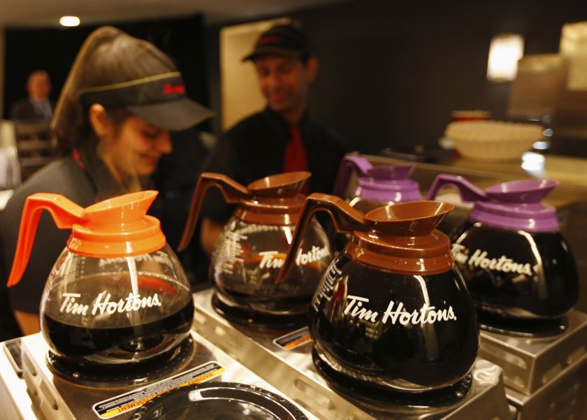 Burger King is in talks to buy Canadian coffee and doughnut chain Tim Horton's in a deal that would be structured as a tax inversion to move the hamburger chain's domicile out of the United States. u00e2u20acu201d Reuters pic
